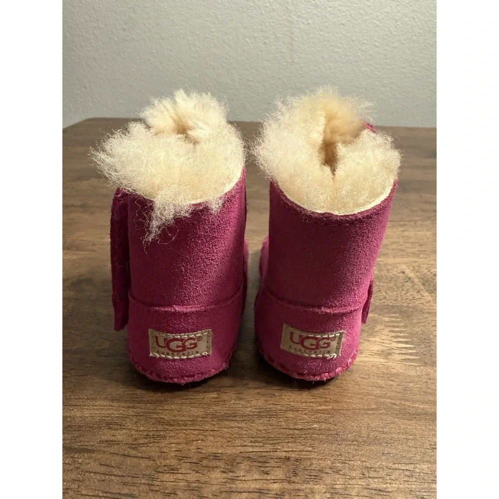 UGG‎ Caden baby booties in fuchsia pink suede with sheepskin lining 0/1